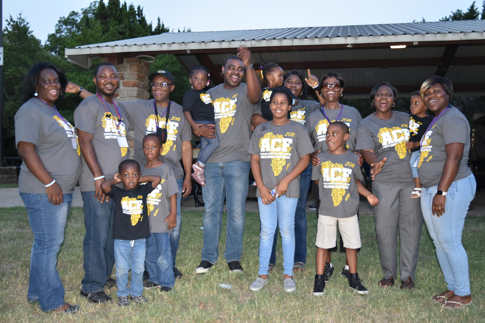 ACF families and their children cheering together at the 2018 South Region Conference picnic in Dallas
