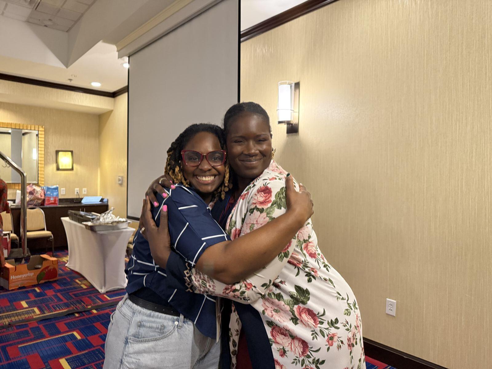 Two women sharing a big hug